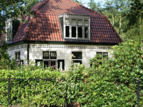  Characteristic house with a garden, surrounded by forest  Де-Булт